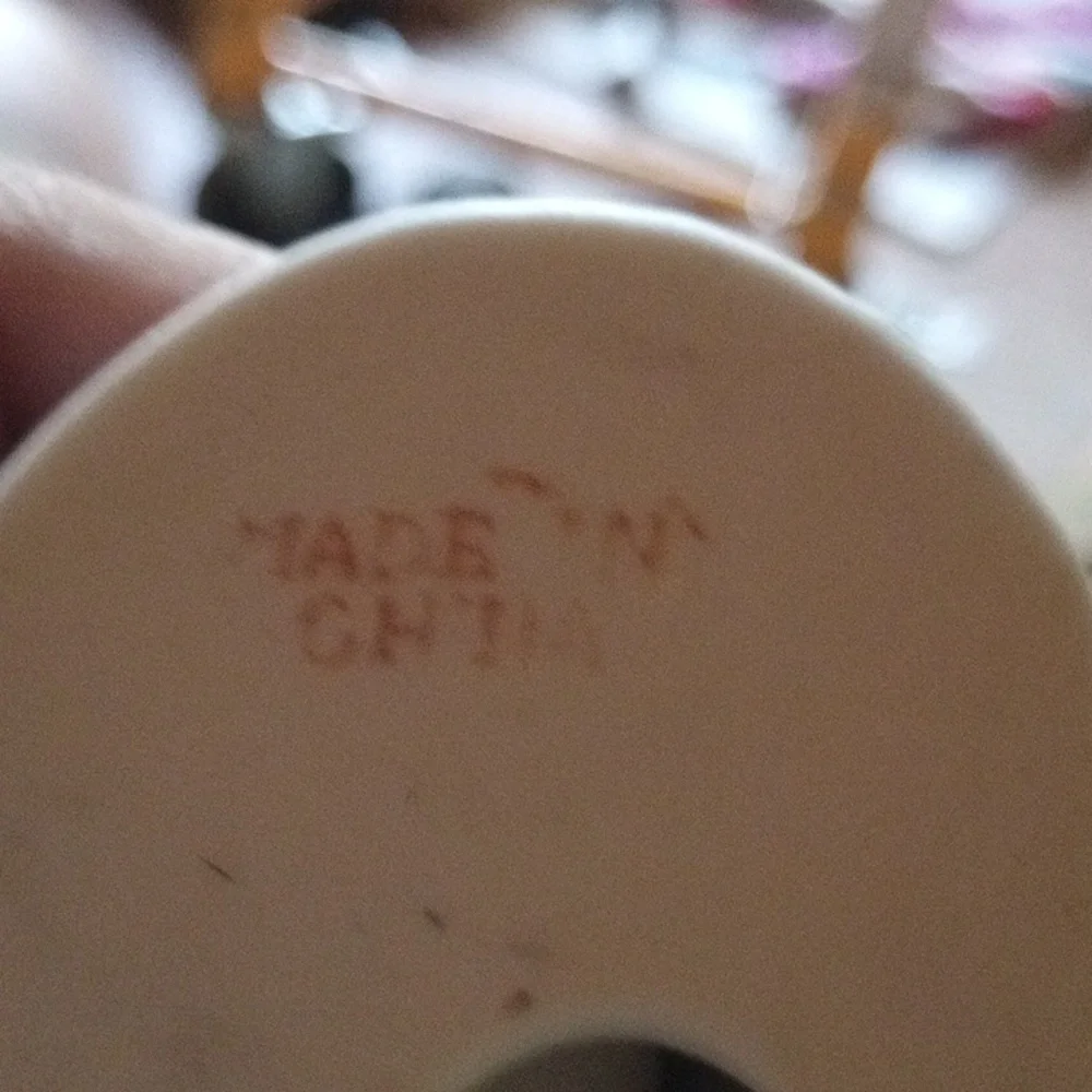 Porcelain Figurine with Floral Base